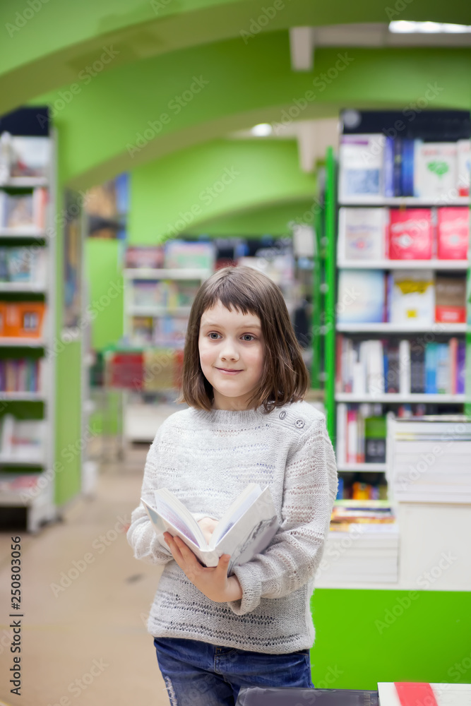   first grader  choosing   books in   bookstore
