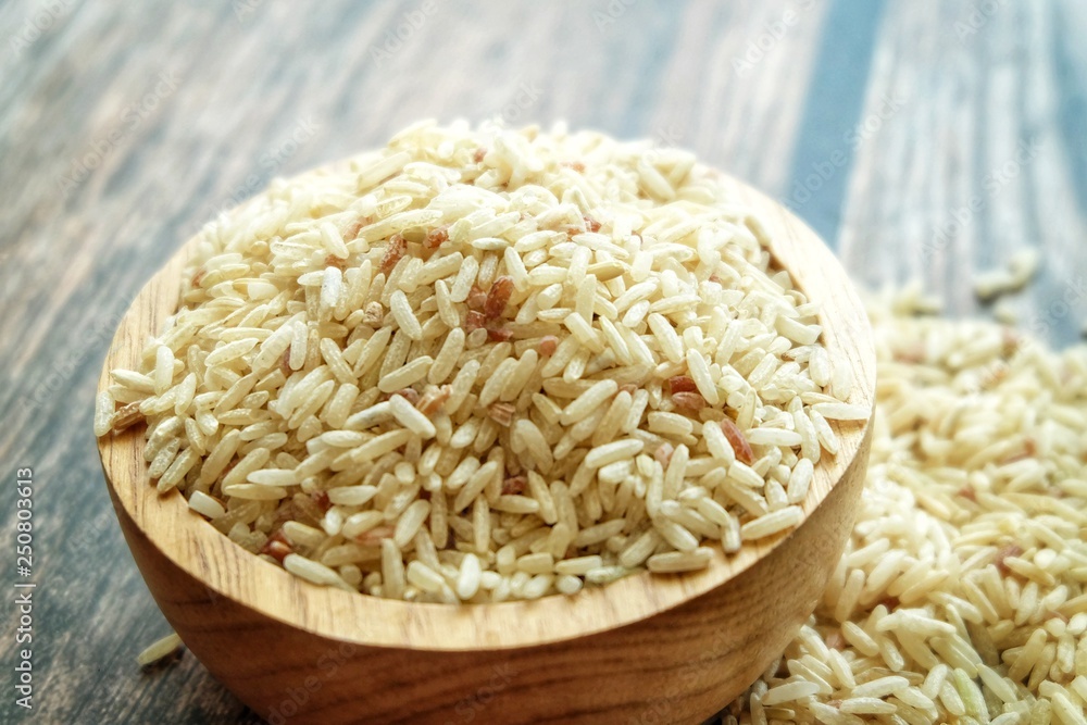 Close up of dirty rice on wooden bowl. Close up of dirty rice on wooden bowl.