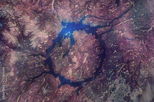Manicouagan Impact Crater, The 50-mile diameter structure was distant past left by a massive meteorite collision . Satellite view, collage with volune effect. Elements of this image furnished by NASA. photo