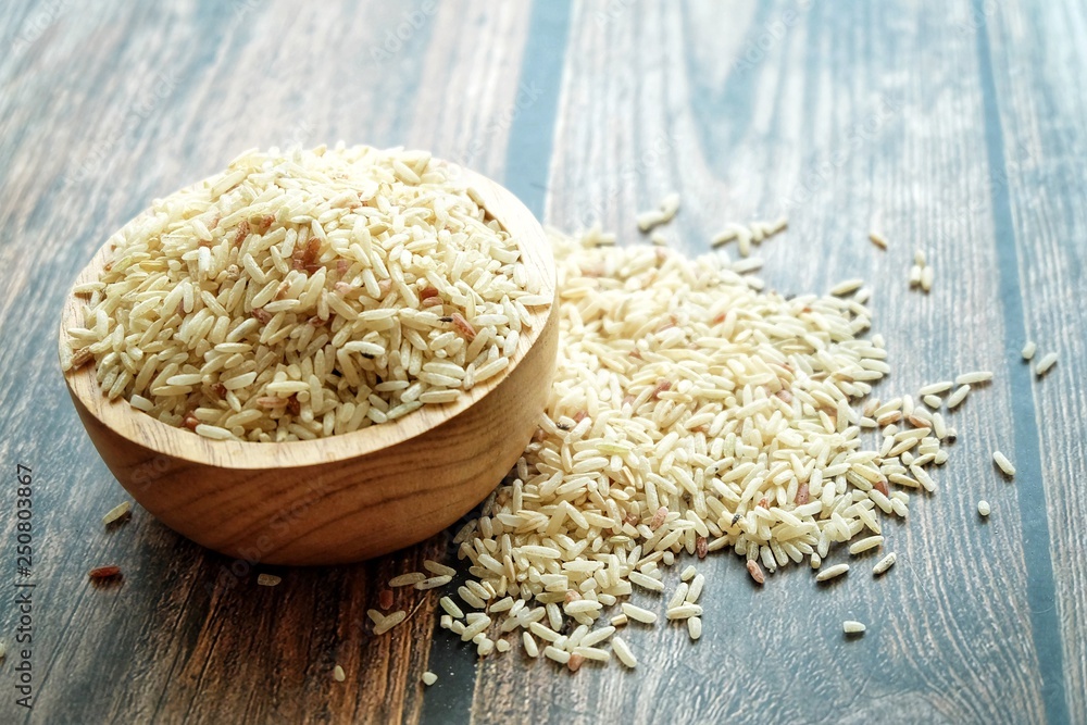 Close up of dirty rice on wooden bowl. Close up of dirty rice on wooden bowl.