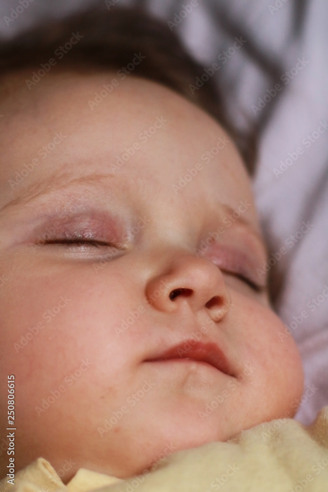 Newborn baby face closeup.