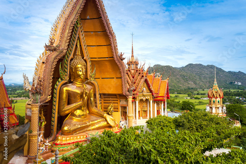 Big golden Buddha in Wat Tham Sua, Kanchanaburi Thailand photo