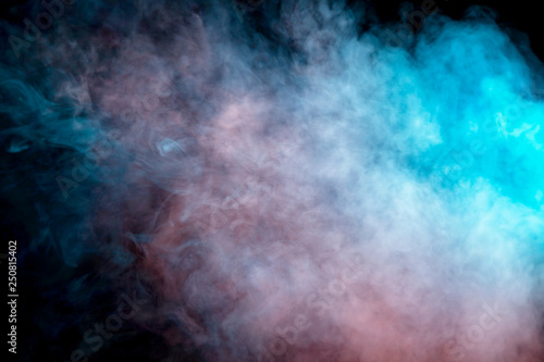 Background of orange, purple, red and blue wavy smoke on a black isolated ground. Abstract pattern of steam from vape of smoothly rising clubs. Mocap and print for t-shirt.