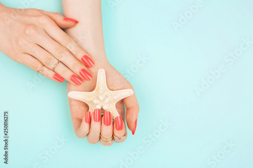 Woman hands on blue background