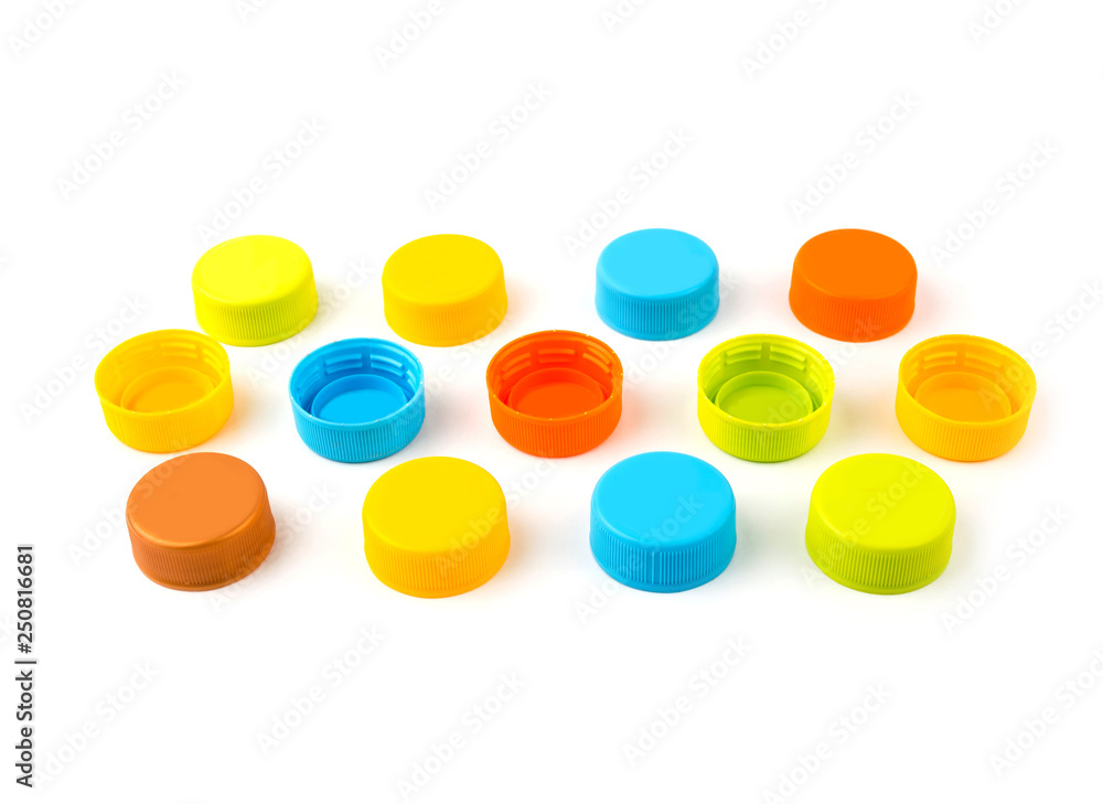 Colorful Plastic bottle caps on white background. selective focus Colorful Plastic bottle caps on white background. selective focus