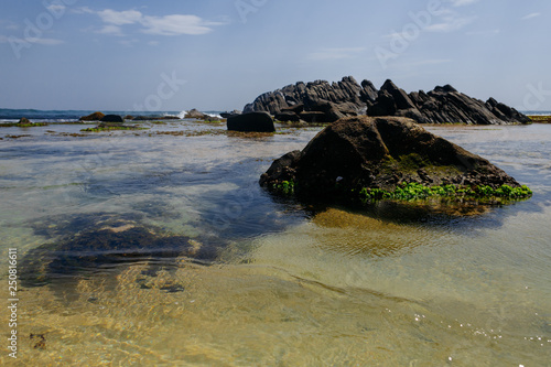 Exotic landscape with stones in ocean, sea