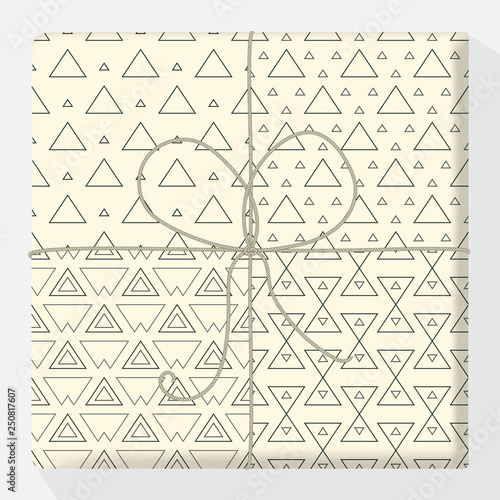 Set of repeating and seamless patterns on a gift box. Mock up vector variation. Modern stylish geometric texture of monochrome shapes of triangle variants. Simple and hipster design illustration