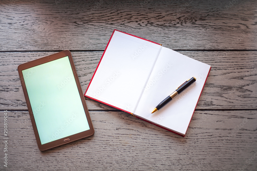 digital tablet on bright wooden table digital tablet on bright wooden table