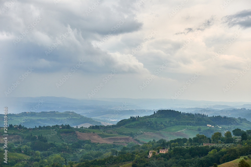 Aerial view Italian landscape Tuscany hills countryside in the rain 