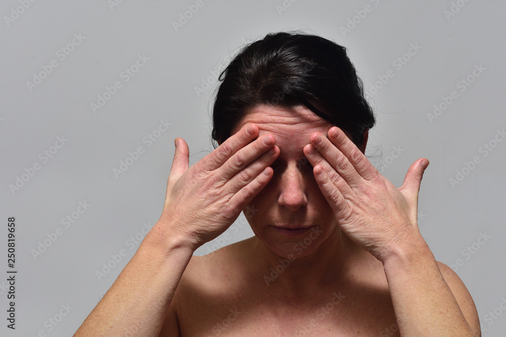 Fototapeta premium middle-aged woman with headache