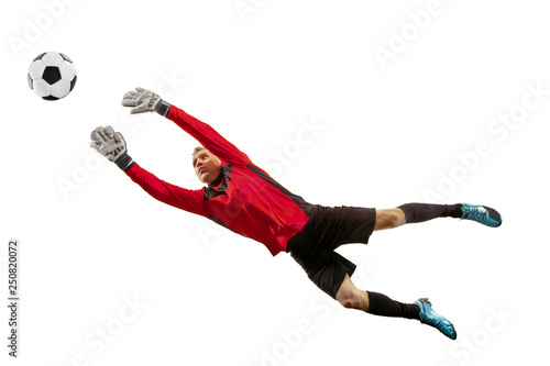 Leinwand Poster Male soccer player goalkeeper catching ball in jump