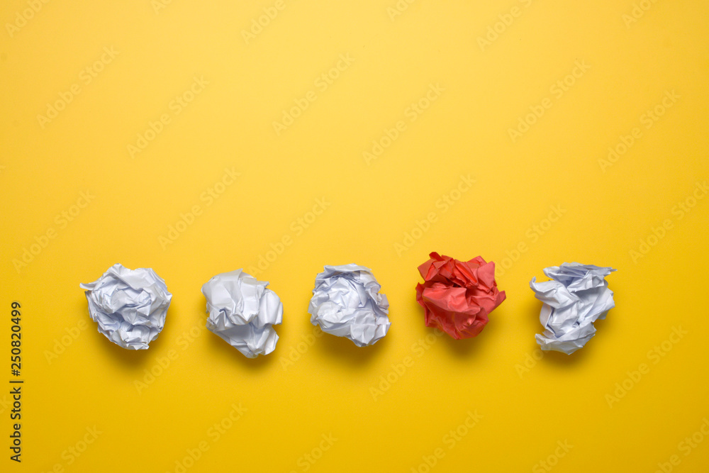 Crumpled paper balls up piece of paper on yellow background. Crumpled paper balls up piece of paper on yellow background.