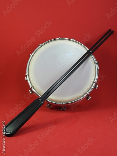 Tamborim and drumstick: a Brazilian percussion musical instrument. It is used to play samba, the famous Brazilian rhythm and has great prominence in the parades of samba schools, in the carnival.