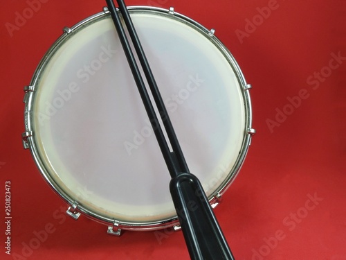 Tamborim and drumstick: a Brazilian percussion musical instrument. It is used to play samba, the famous Brazilian rhythm and has great prominence in the parades of samba schools, in the carnival.