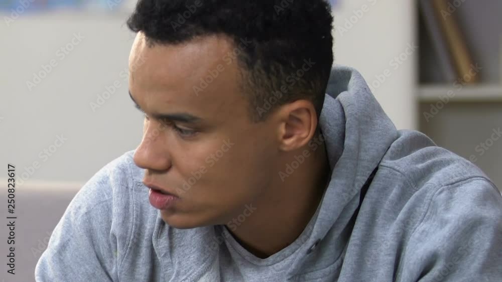 Nervous young african american guy at psychologist office, depression therapy Nervous young african american guy at psychologist office, depression therapy