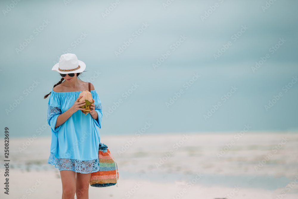 Young beautiful woman on the beach vacation