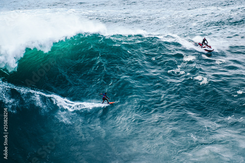 Photography surfing big waves at Nazaré, Portugal