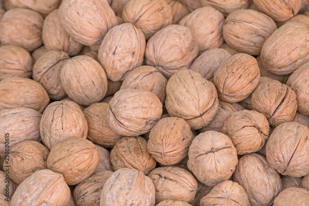 close up of heap of walnuts on market close up of heap of walnuts on market