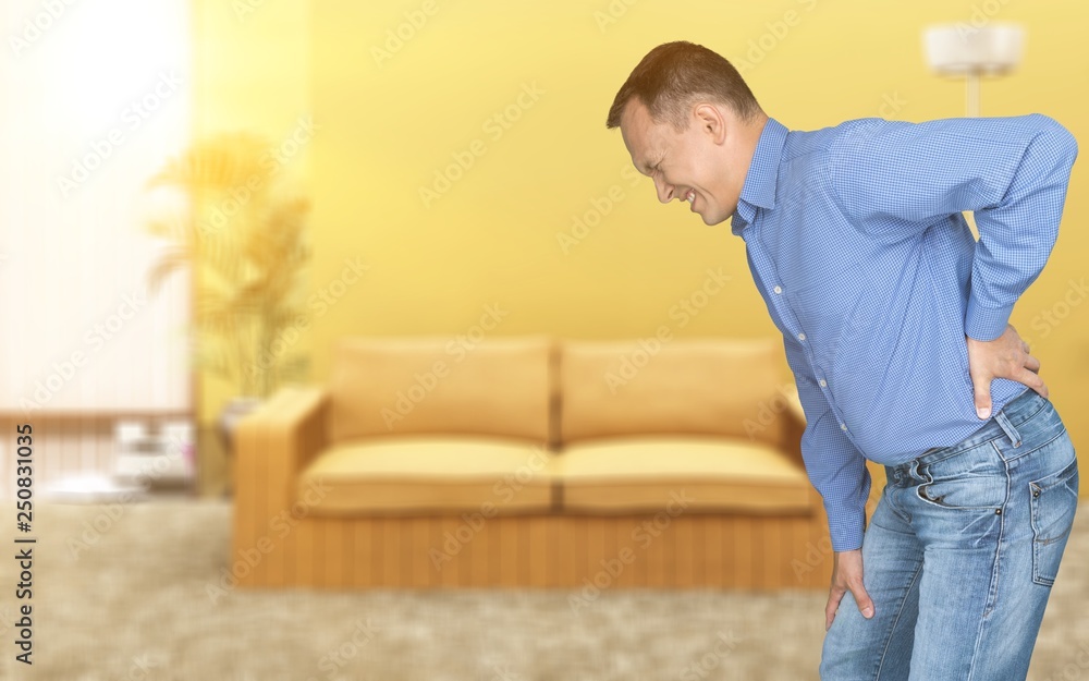 Fototapeta premium Mature man with backache isolated on white background