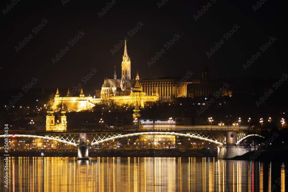 The Buda Castle by night with reflections on the river Danube, in Budapest, Hungary