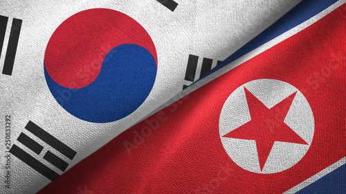 South Korea and North Korea two flags textile cloth, fabric texture photo