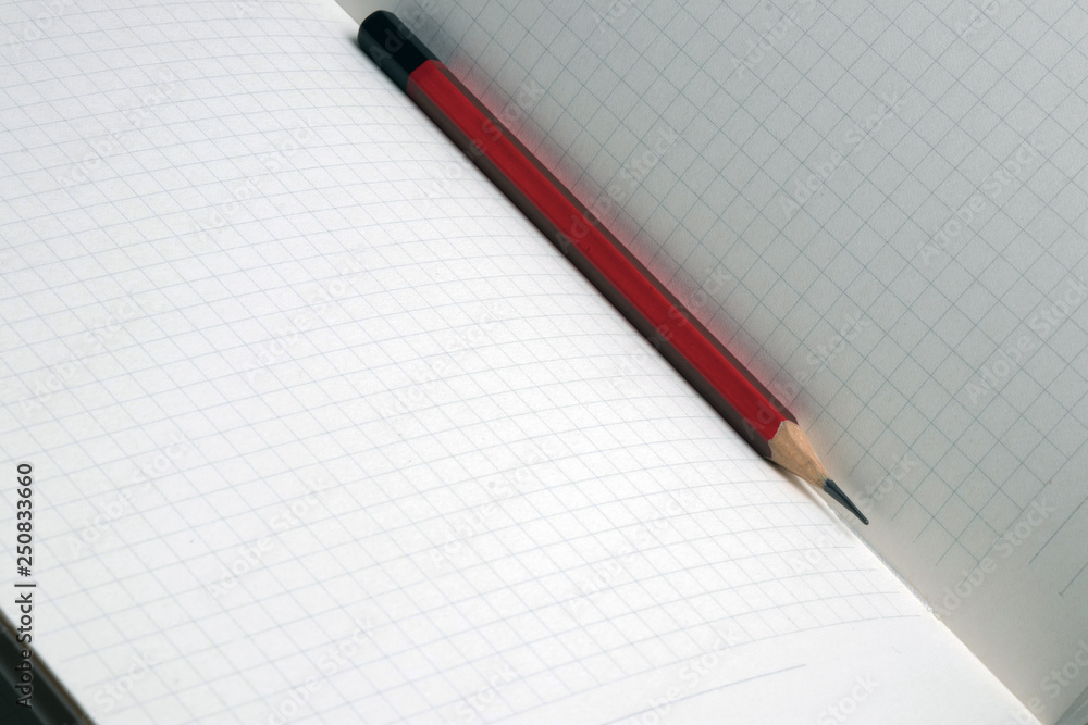 Pencil on notebook ready for different notes Pencil on notebook ready for different notes