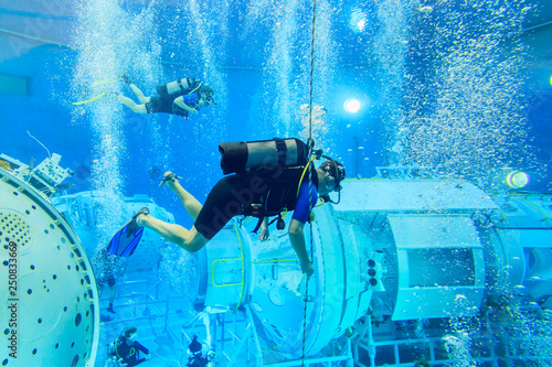 MOSCOW REGION, RUSSIA - FEBRUARY 14, 2014: The International Space Station plunged into the test pool of the Cosmonaut Training Center, divers training, editorial