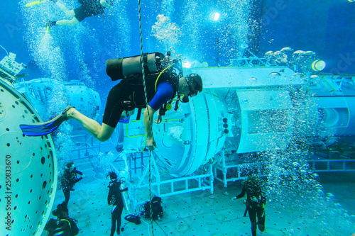 MOSCOW REGION, RUSSIA - FEBRUARY 14, 2014: The International Space Station plunged into the test pool of the Cosmonaut Training Center, divers training, editorial