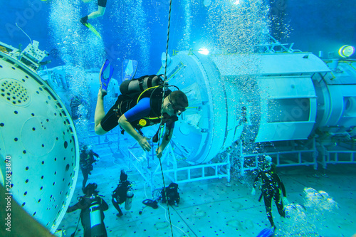 MOSCOW REGION, RUSSIA - FEBRUARY 14, 2014: The International Space Station plunged into the test pool of the Cosmonaut Training Center, divers training, editorial
