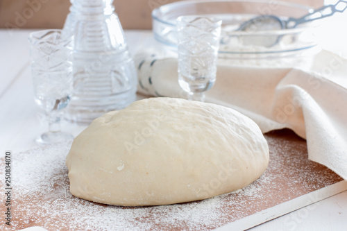 Raw unleavened dough made using vodka, selective focus photo