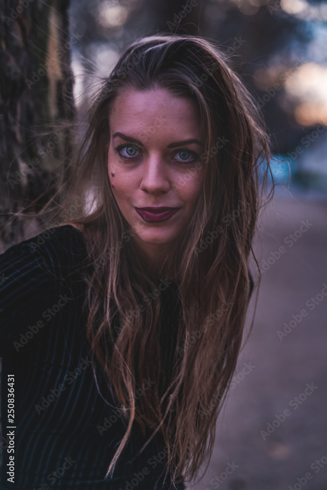 fashionable portrait of young beautiful woman in a European city on a sunny winter day fashionable portrait of young beautiful woman in a European city on a sunny winter day