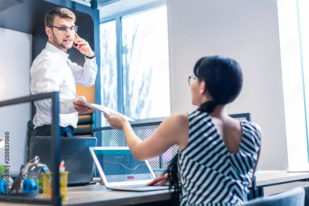 Fototapeta premium Professional manager talking to his young colleague