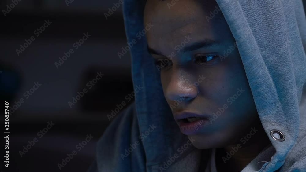 Lonely african american teenager pondering on problems at night, awkward age Lonely african american teenager pondering on problems at night, awkward age
