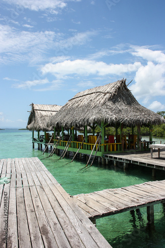 Jetty with caribbean straw hut on Bastimento, Bocas del Toro Panama