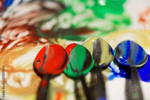 Spoons with different colors for painting