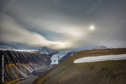 The unbridled force of nature at Longyear Glacier, Svalbard. In the Arctic summer, Spitsbergen glaciers melt, making walking across them very.difficult and potentially dangerous.