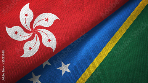 Hong Kong and Solomon Islands two flags textile cloth, fabric texture photo