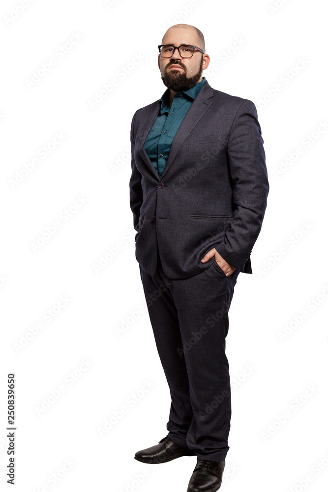 Serious young bald man in glasses with a beard, full height. Isolated on a white background. Serious young bald man in glasses with a beard, full height. Isolated on a white background.