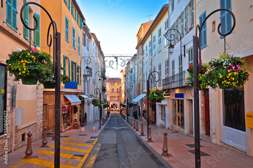 Colorful street in Antibes walkway and shops view photo