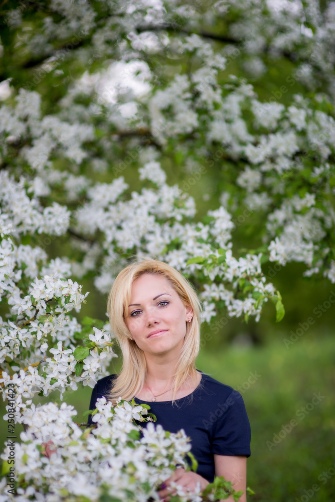 Beautiful girl on the background of spring bush Beautiful girl on the background of spring bush