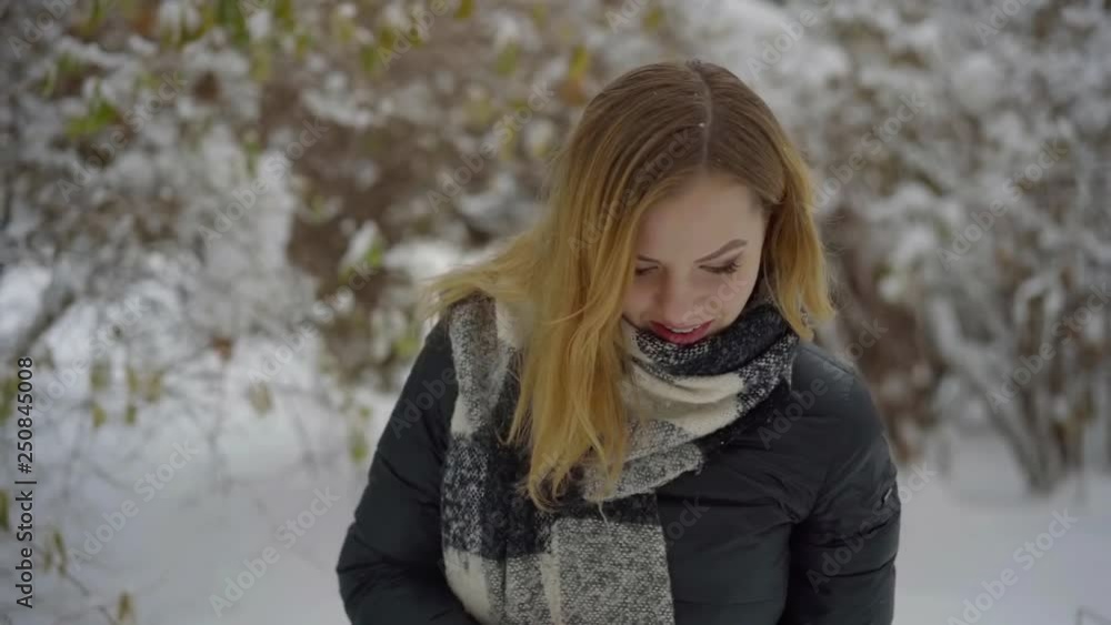 Cute young girl walking in the winter snow Park in the afternoon Cute young girl walking in the winter snow Park in the afternoon
