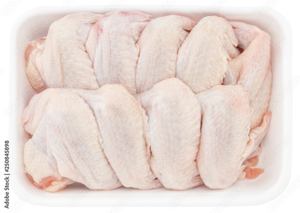 raw chicken wings in tray isolated on white background