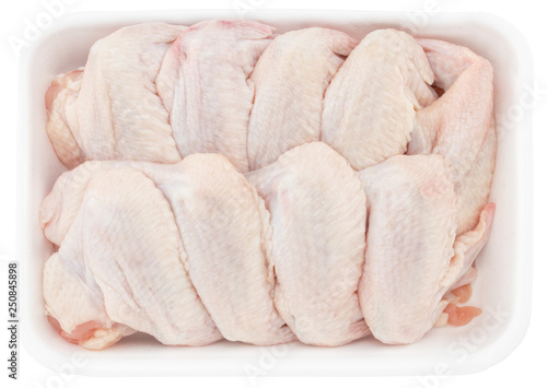 Obraz na płótnie raw chicken wings in tray isolated on white background w salonie