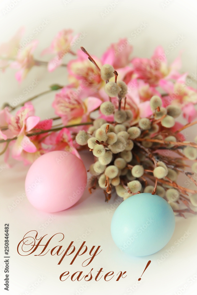 pink yellow blue eggs against a background of willow and flowers for the Easter holiday pink yellow blue eggs against a background of willow and flowers for the Easter holiday