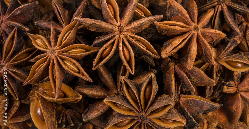 anise stars background. Natural seasoning texture. anise stars background. Natural seasoning texture.