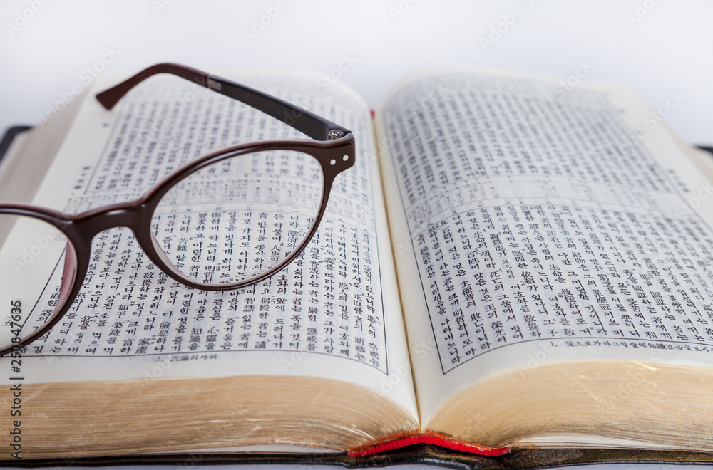 opened bible on the desk with glasses 8 opened bible on the desk with glasses 8