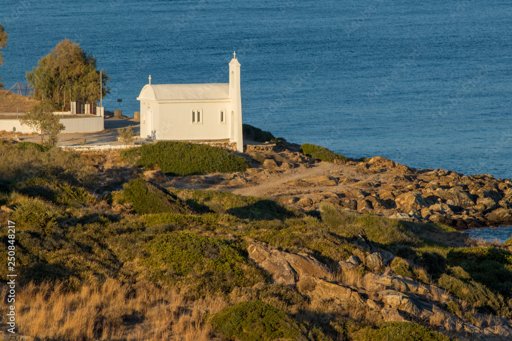 white church on shoreline on Samos island