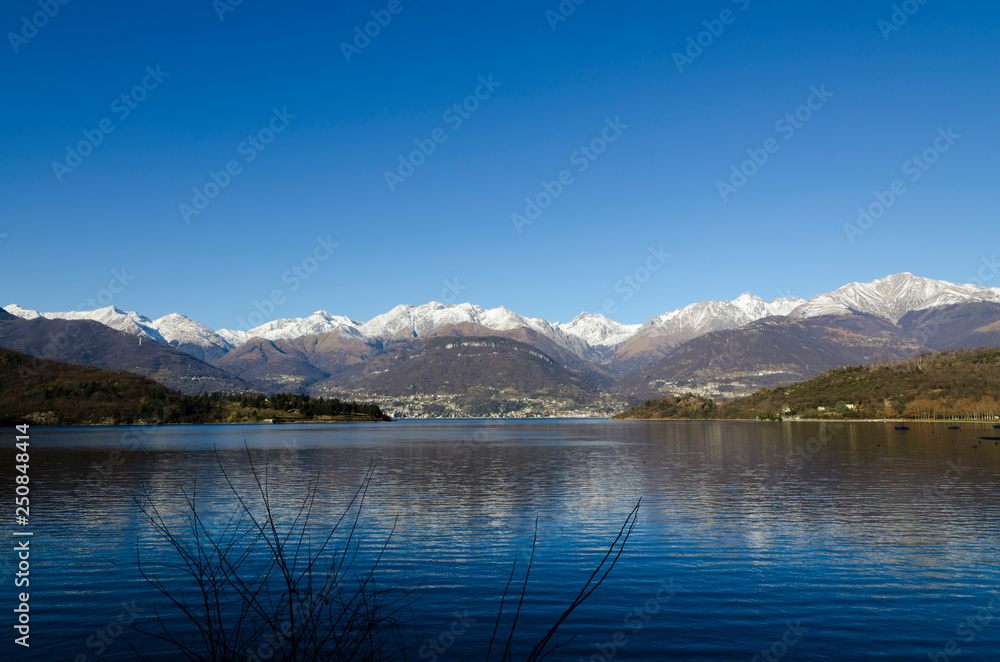Alpine Lake Como with Snow-capped Mountain in Lombardy, Italy.