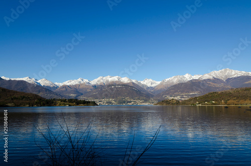 Fototapeta Naklejka Na Ścianę i Meble -  Alpine Lake Como with Snow-capped Mountain in Lombardy, Italy.