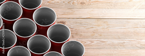 Red white color cups on wooden background, banner, copy space. 3d illustration